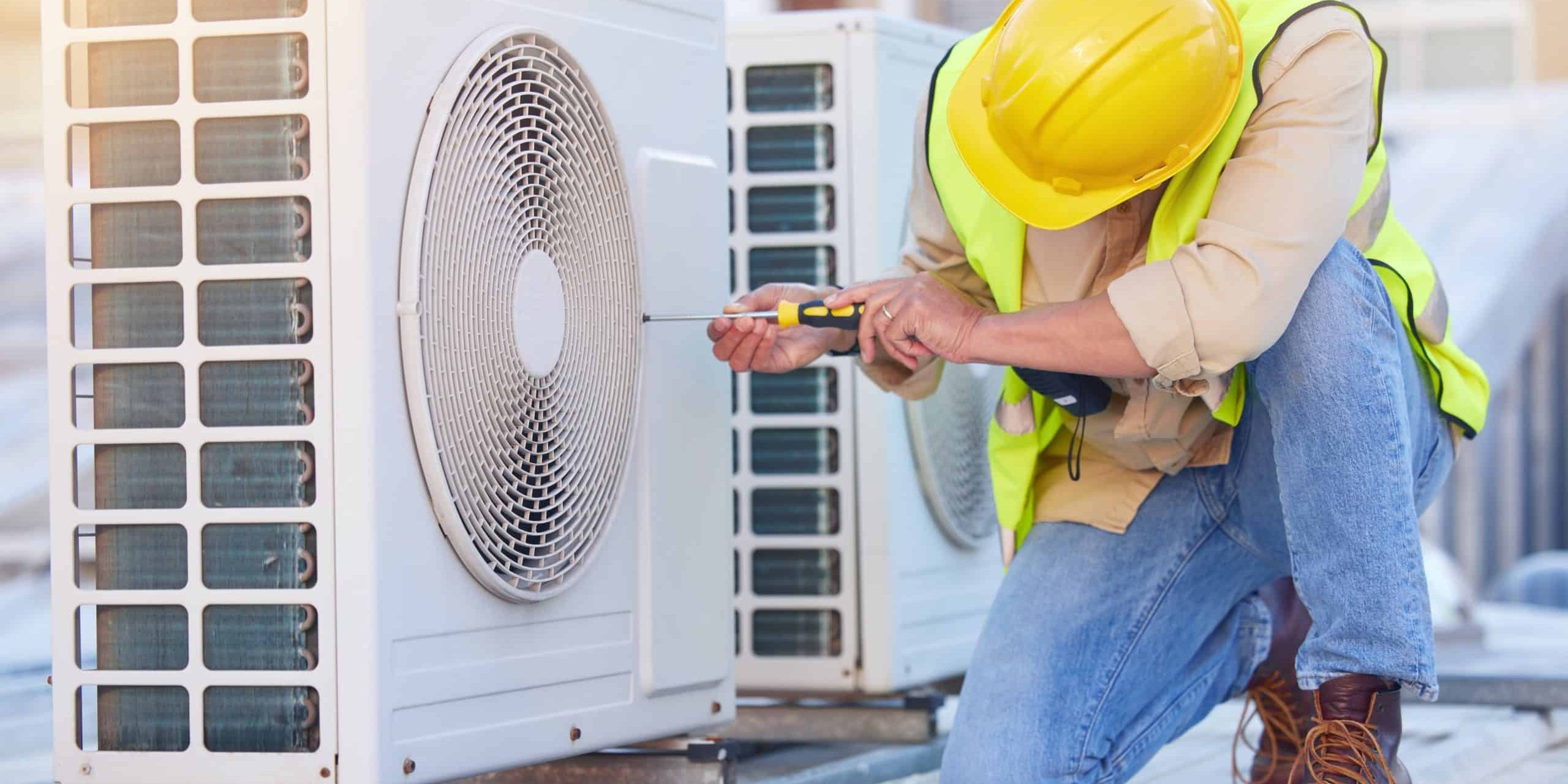 Air conditioning, technician or engineer on roof for maintenance, building or construction of fan hvac repair. Air conditioner, handyman or worker with tools working on a city development project job